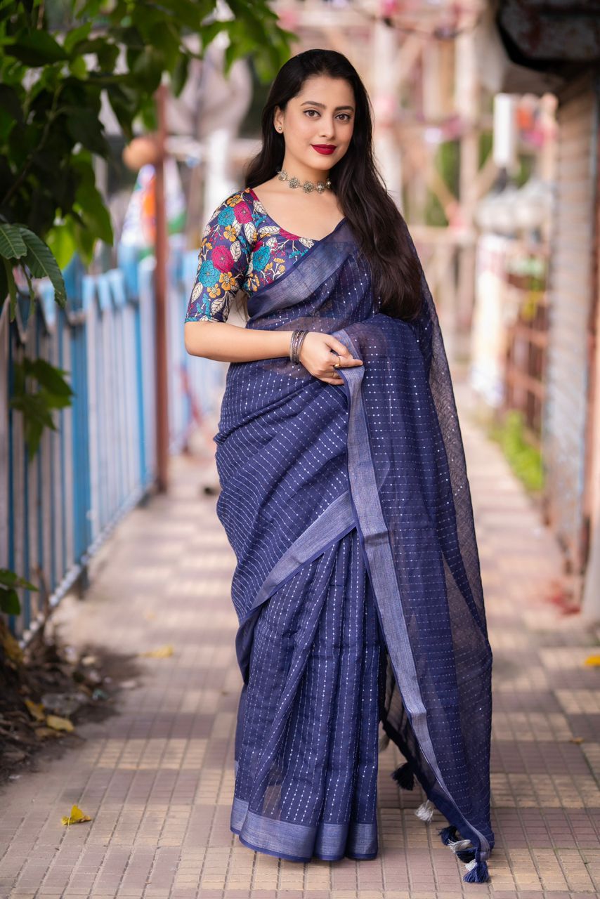 "Elegant Linen Saree with Golden Pattu Border and Sequence Work"