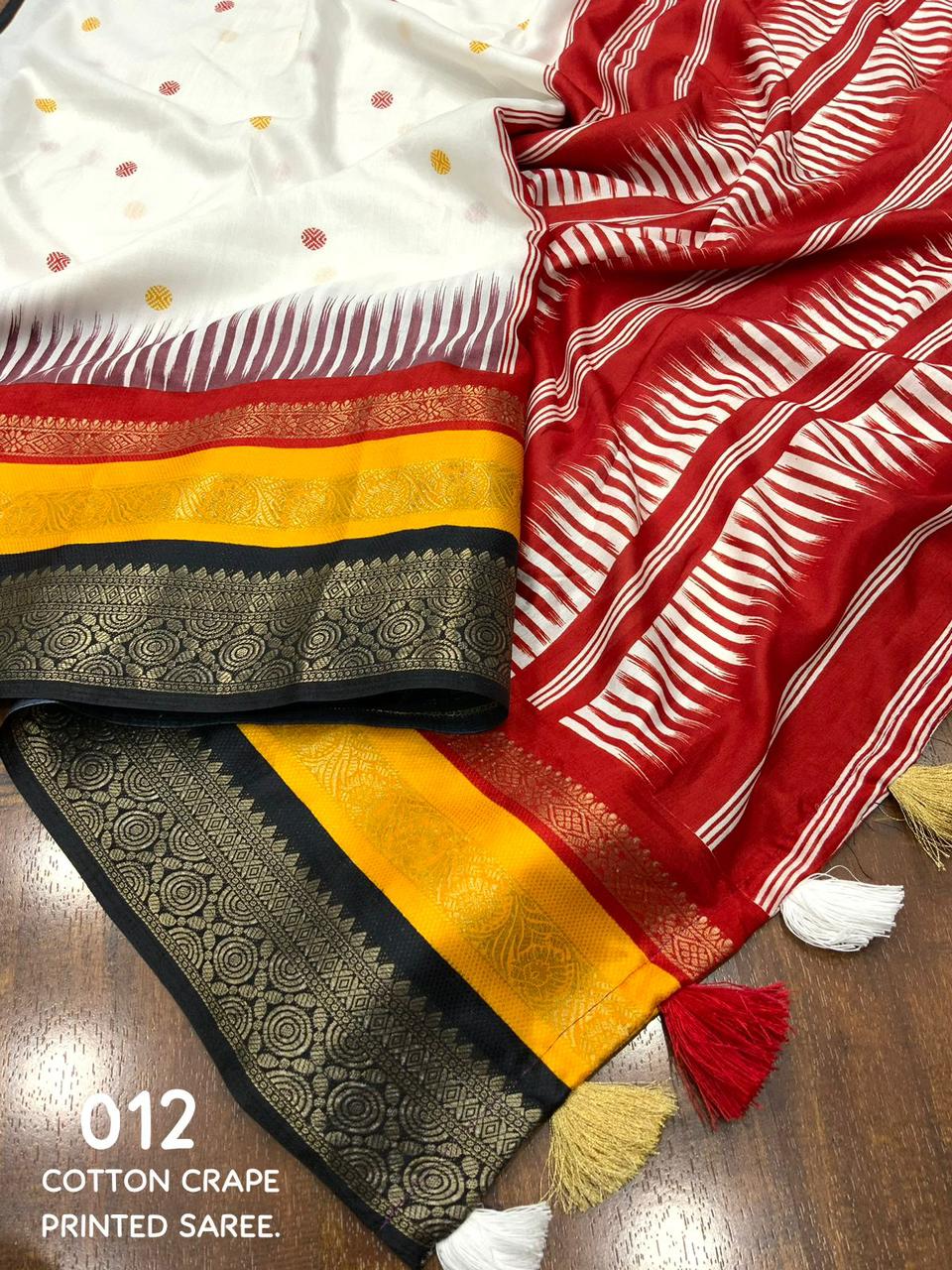 "Timeless Elegance: Soft Cotton Crape Saree with Woven Zari Border and Contrast Black Blouse - Perfectly Crafted Harmony of Printing and Weaving"