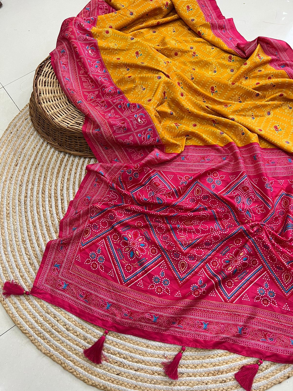 "Silken Elegance: Exquisite Patola Bandhani Sarees with Tassel Detailing"