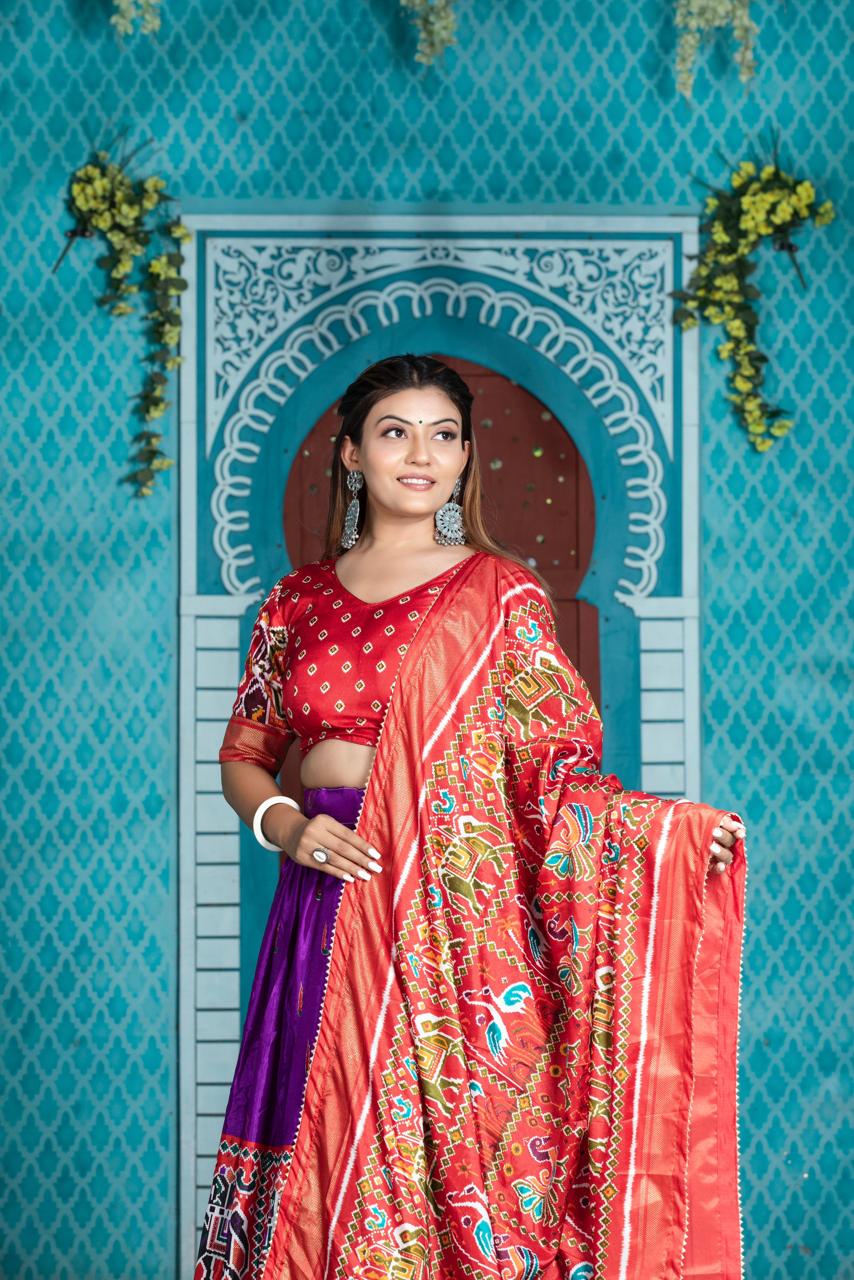 "Paithani Patola Perfection: Vibrant Dola Silk Lehenga Ensemble"