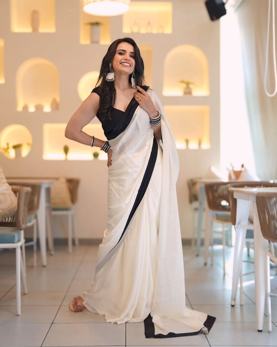 "DevSena White Saree: Elegant Japan Satin with Black Lace Border"