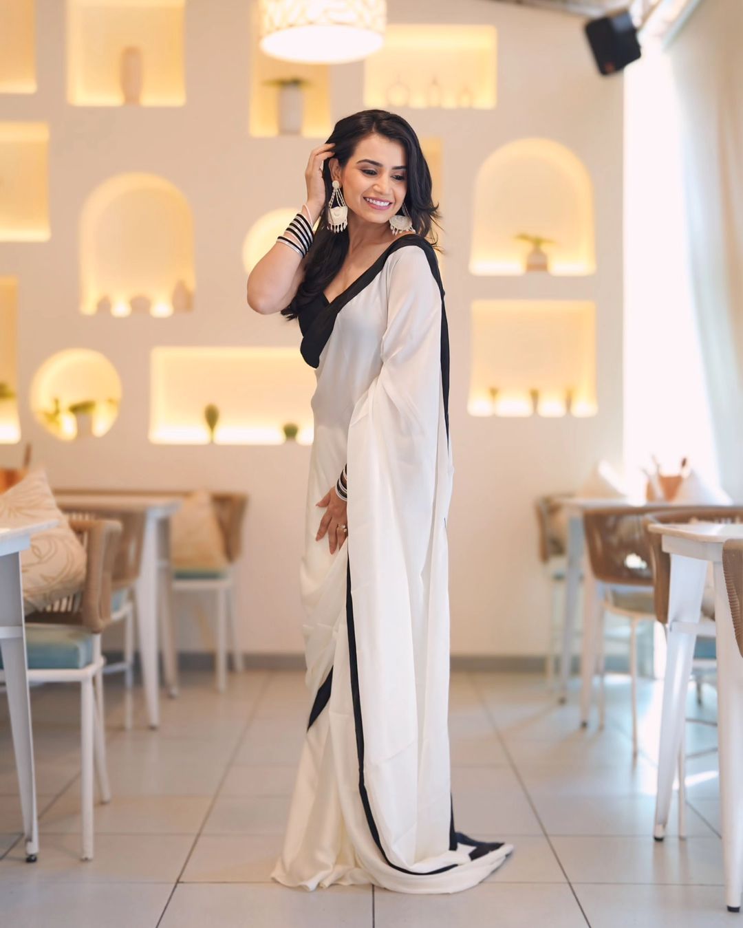 "DevSena White Saree: Elegant Japan Satin with Black Lace Border"