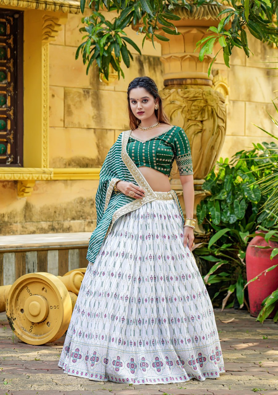 "White Angel Lahenga Choli & Men's Kurta Set: Elegant White & Green Ensemble for Couples"