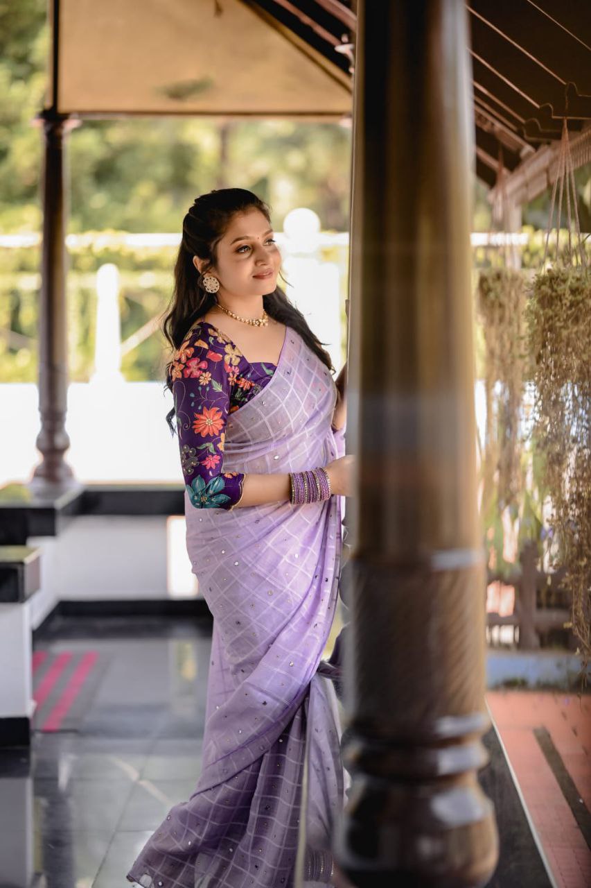 Lavender Linen Velvet Chex Saree with Aari Mirror & Stone Work and Upton Dolla Crape Printed Blouse