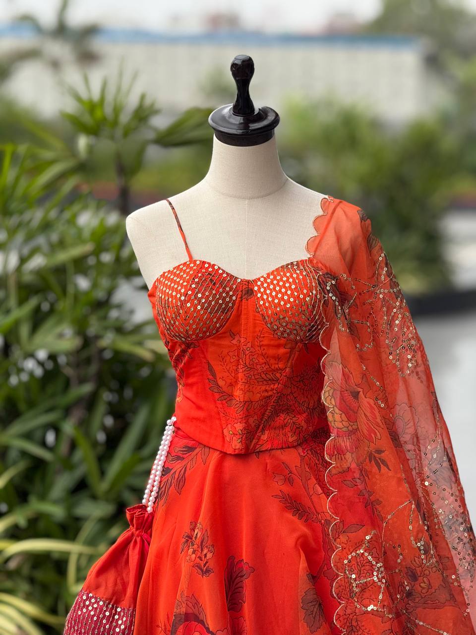Elegant Digital Print Organza Lehenga ,Corset Blouse , Embroidered Dupatta and Batwa Purse