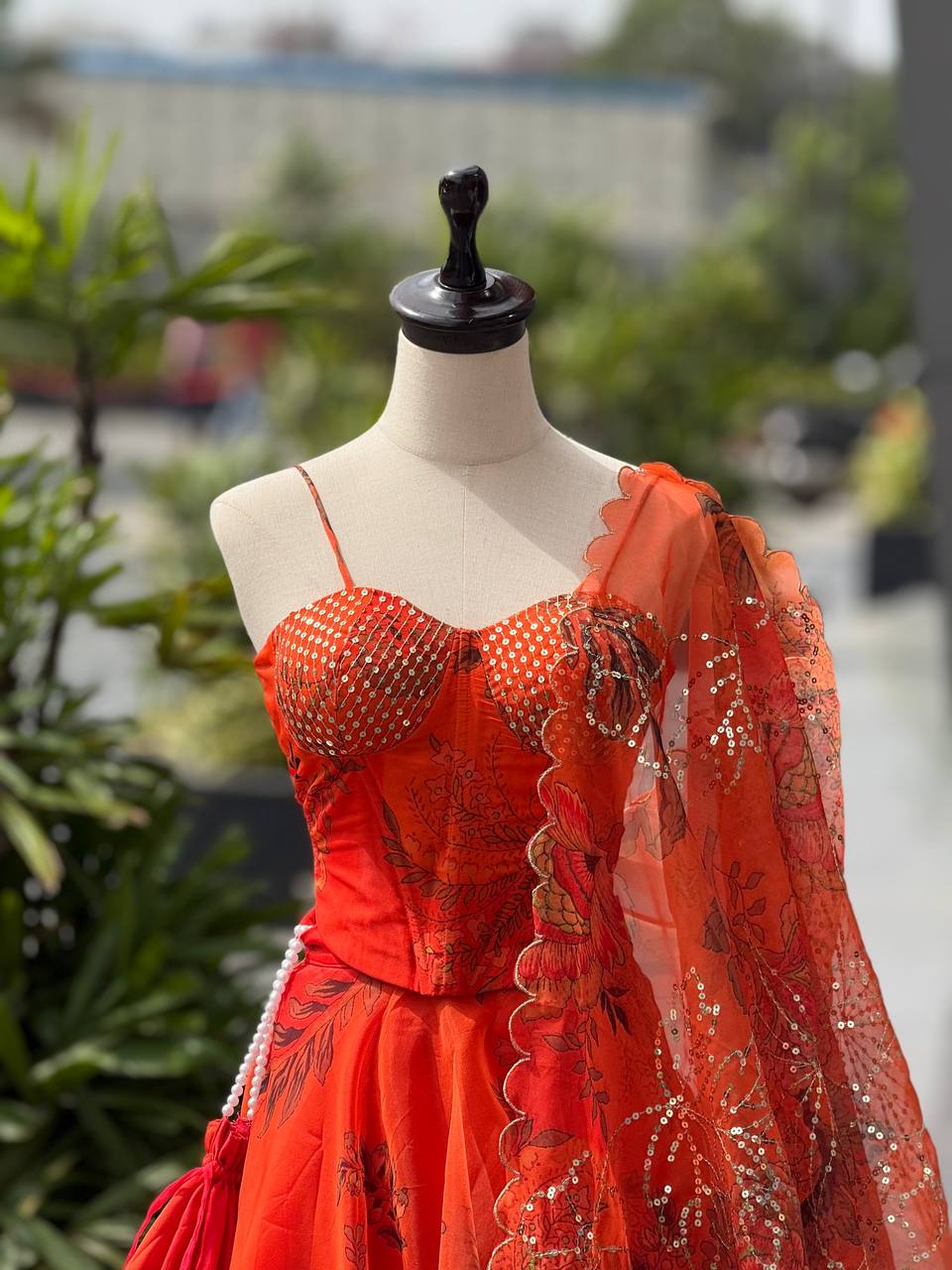 Elegant Digital Print Organza Lehenga ,Corset Blouse , Embroidered Dupatta and Batwa Purse